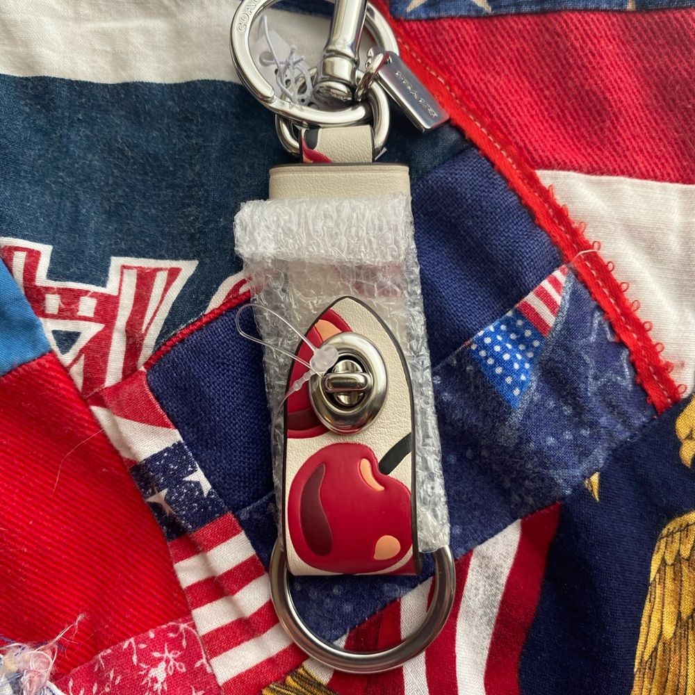 Coach Keychain with Red and Cream Floral Design